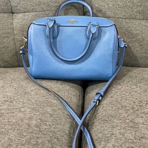 Blue small Coach purse. Stain inside bag